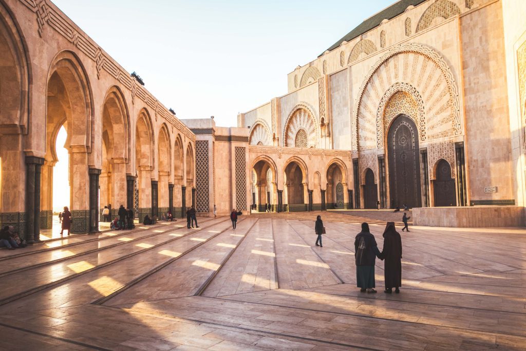 people walking in hassan II mosque square - Casablanca, Morocco.