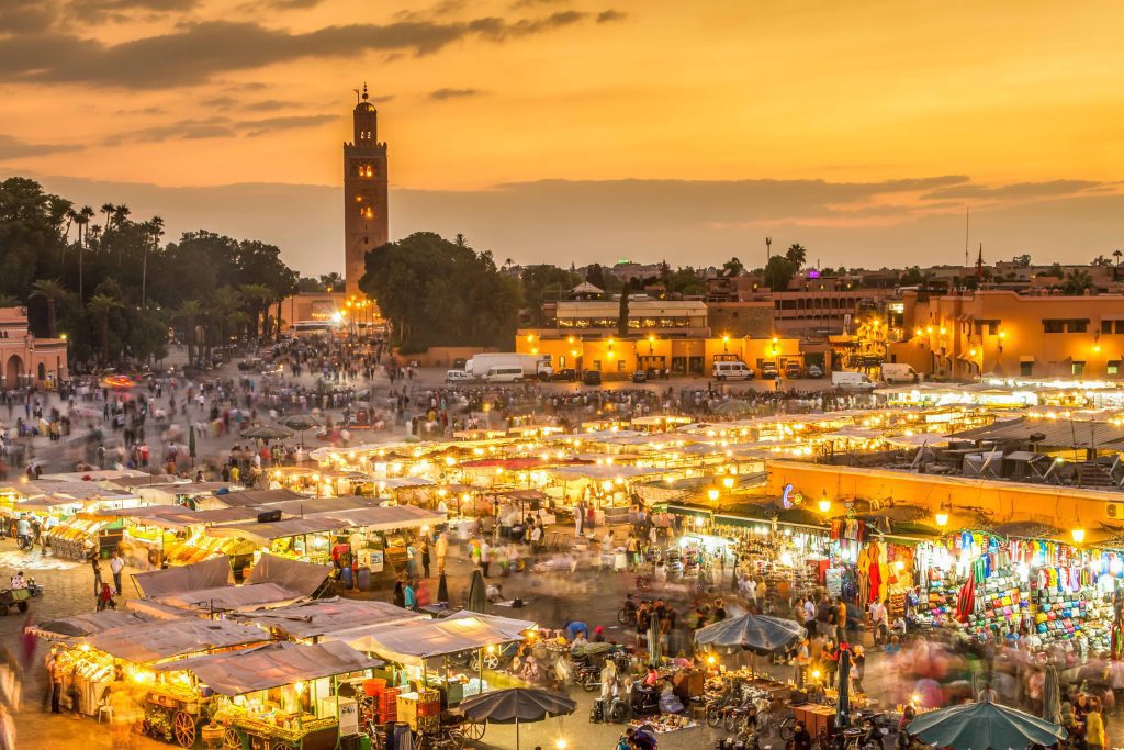 Jamaa el Fna market square in sunset, Marrakesh, Morocco.
