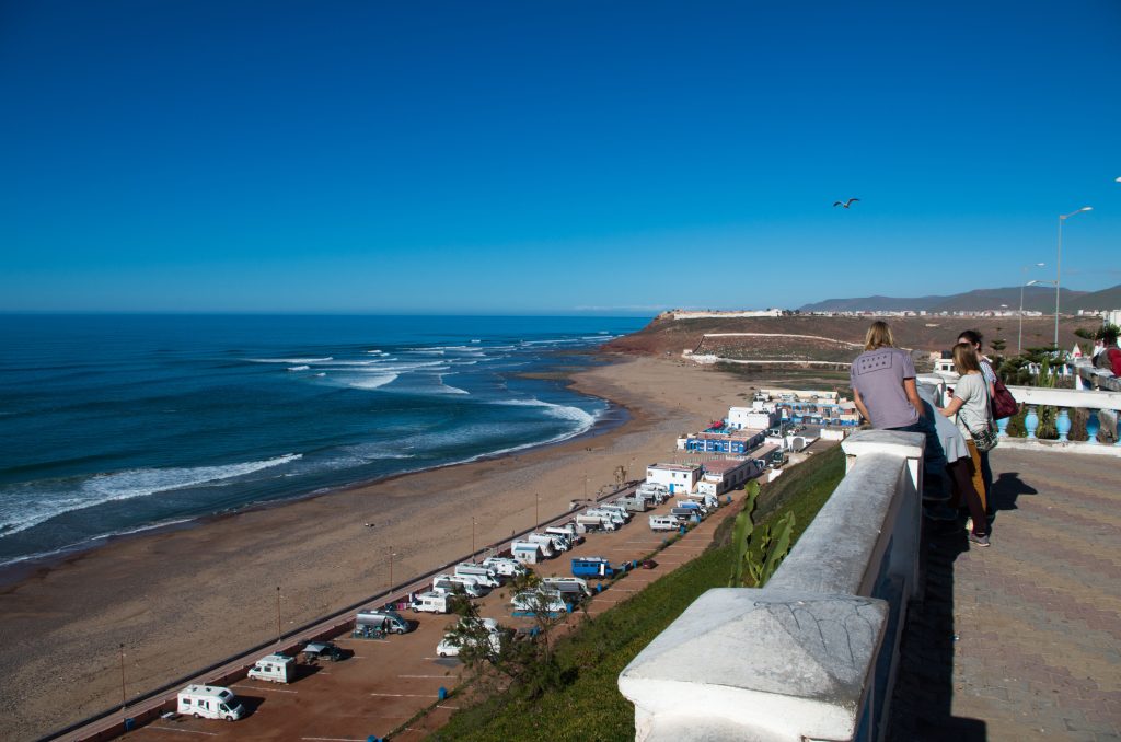 A tourist family enjoying the view of sidi ifni beach.