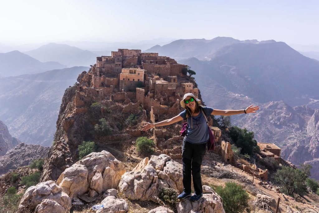 A visitor enjoying the view of the village of Timjisht.